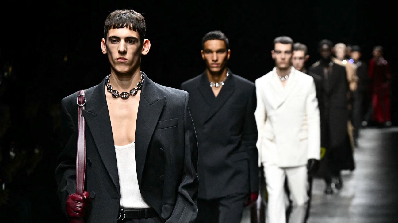 Editorial photograph — Gucci leather goods in dramatic low light